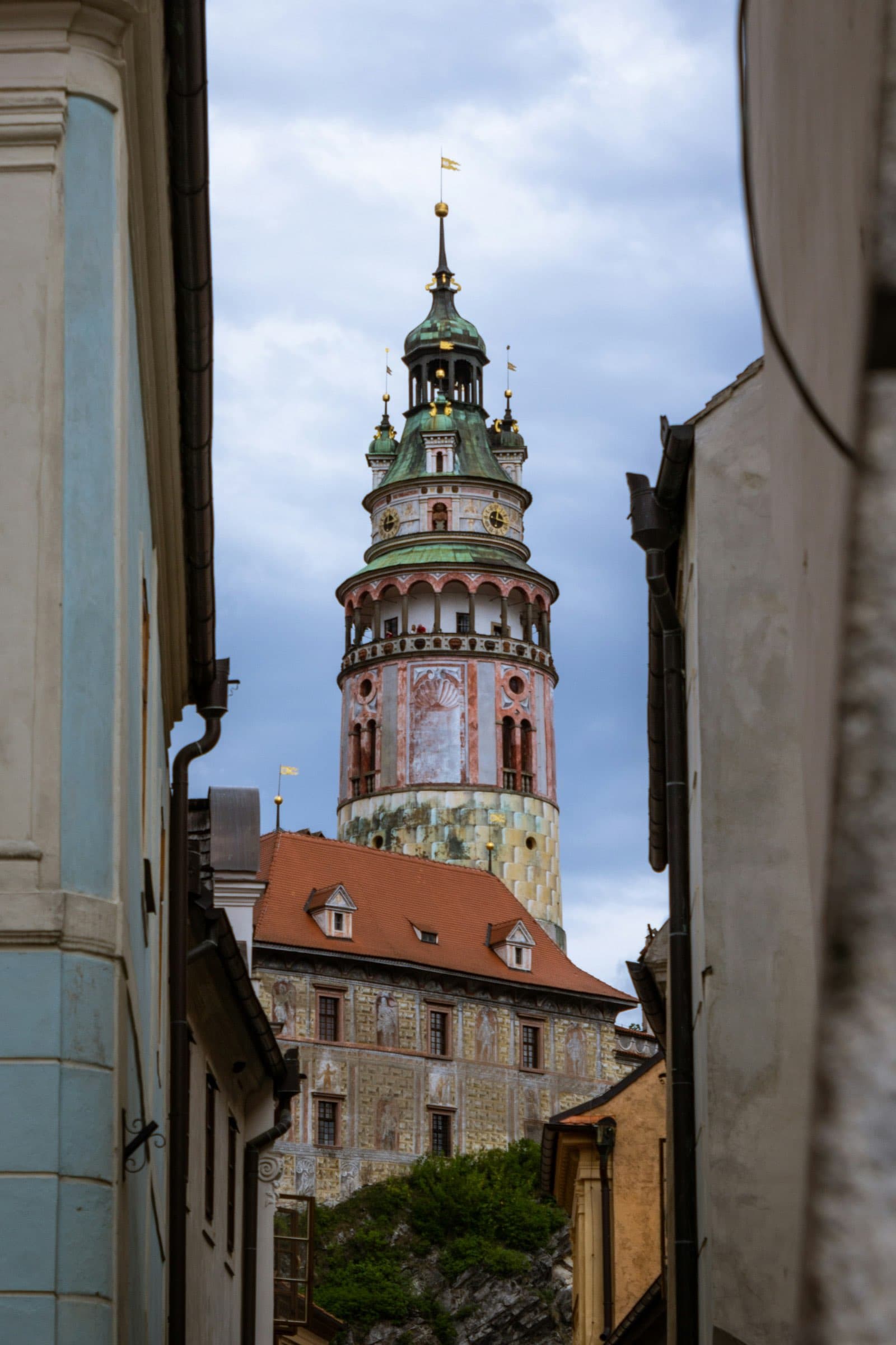 The Český Krumlov castle tower framed between two walls