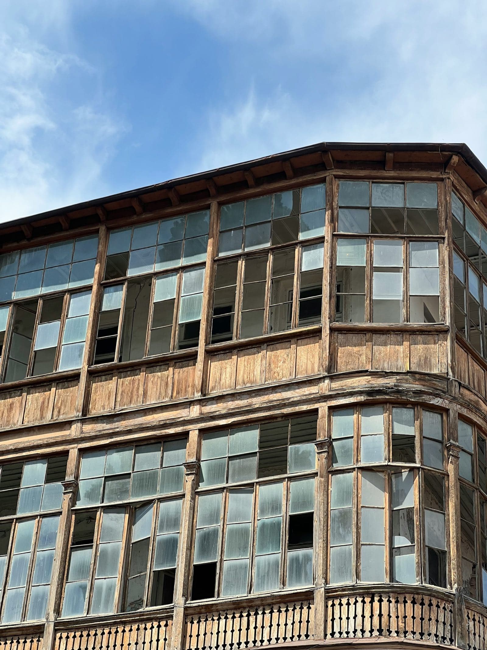 Weathered glazed wooden balconies in old Tbilisi